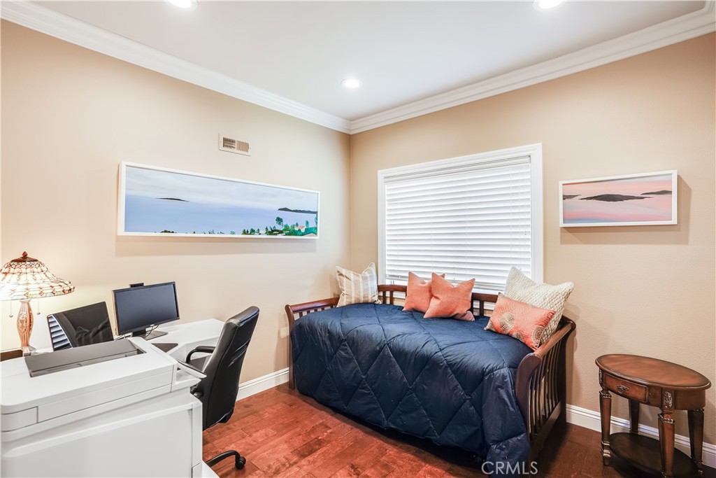 6 Marquesa Dana Point, CA 92629 - Photo 35 of 46 a bedroom with a bed and a computer on a desk next to a window