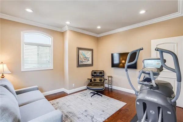 a living room with furniture a rug and a window
