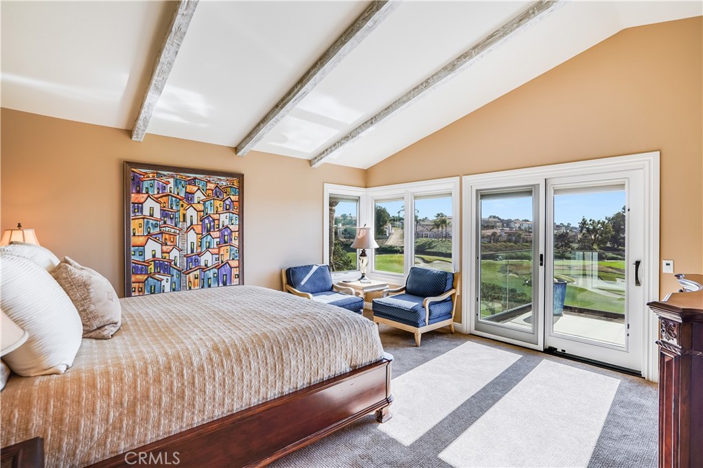 6 Marquesa Dana Point, CA 92629 - Photo 40 of 46 a bedroom with a large bed and a large window