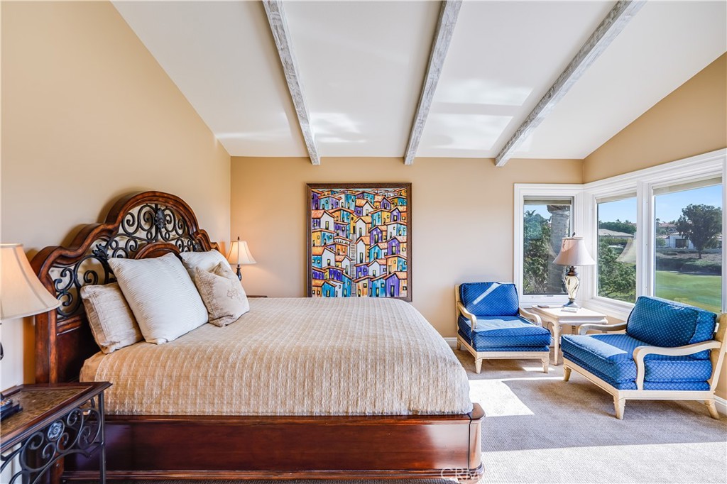 6 Marquesa Dana Point, CA 92629 - Photo 41 of 46 a bedroom with a bed a couch and a large window