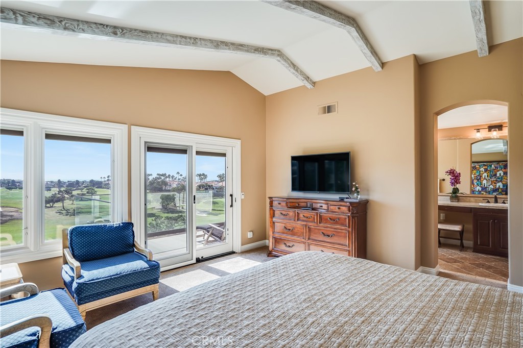 6 Marquesa Dana Point, CA 92629 - Photo 42 of 46 a bedroom with furniture and a flat screen tv