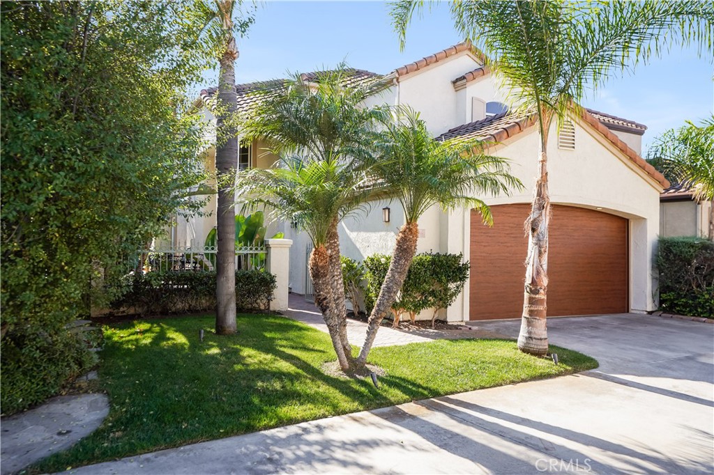 6 Marquesa Dana Point, CA 92629 - Photo 10 of 46 front view of house with a yard and potted plants
