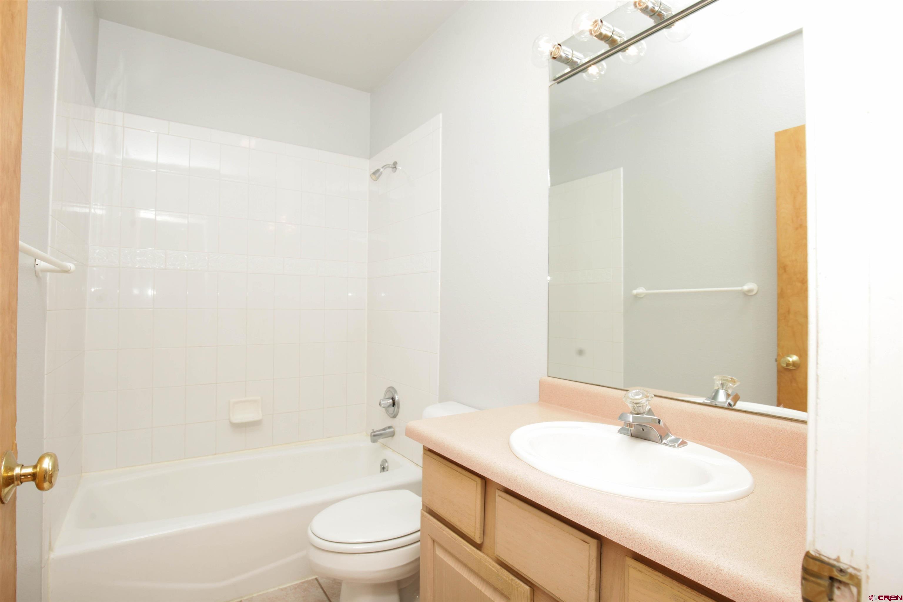 525 Red Lady Avenue, Unit 241 246 Crested Butte, CO 81224 - Photo 15 of 17 a bathroom with a sink toilet tub and shower