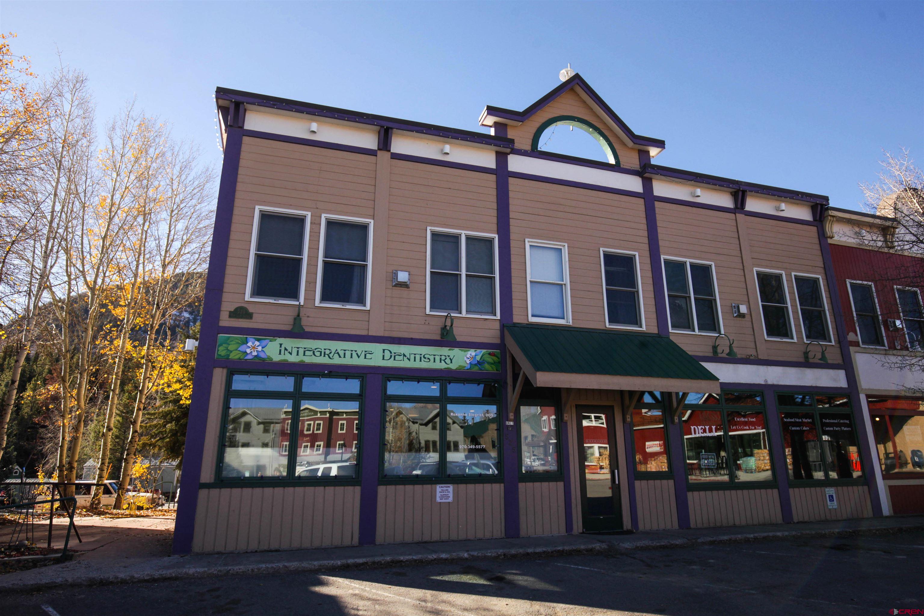 525 Red Lady Avenue, Unit 241 246 Crested Butte, CO 81224 - Photo 5 of 17 a front view of residential houses with street