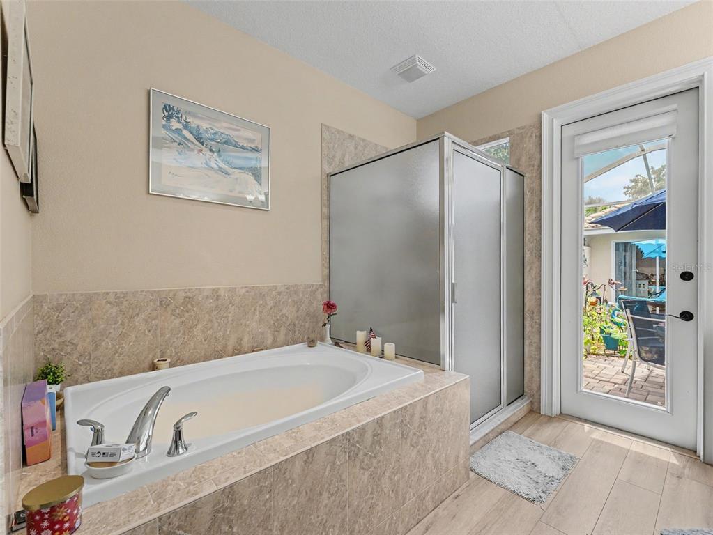 8910 Jericho Road Weeki Wachee, FL 34613 - Photo 34 of 52 a bathroom with a bathtub and a shower
