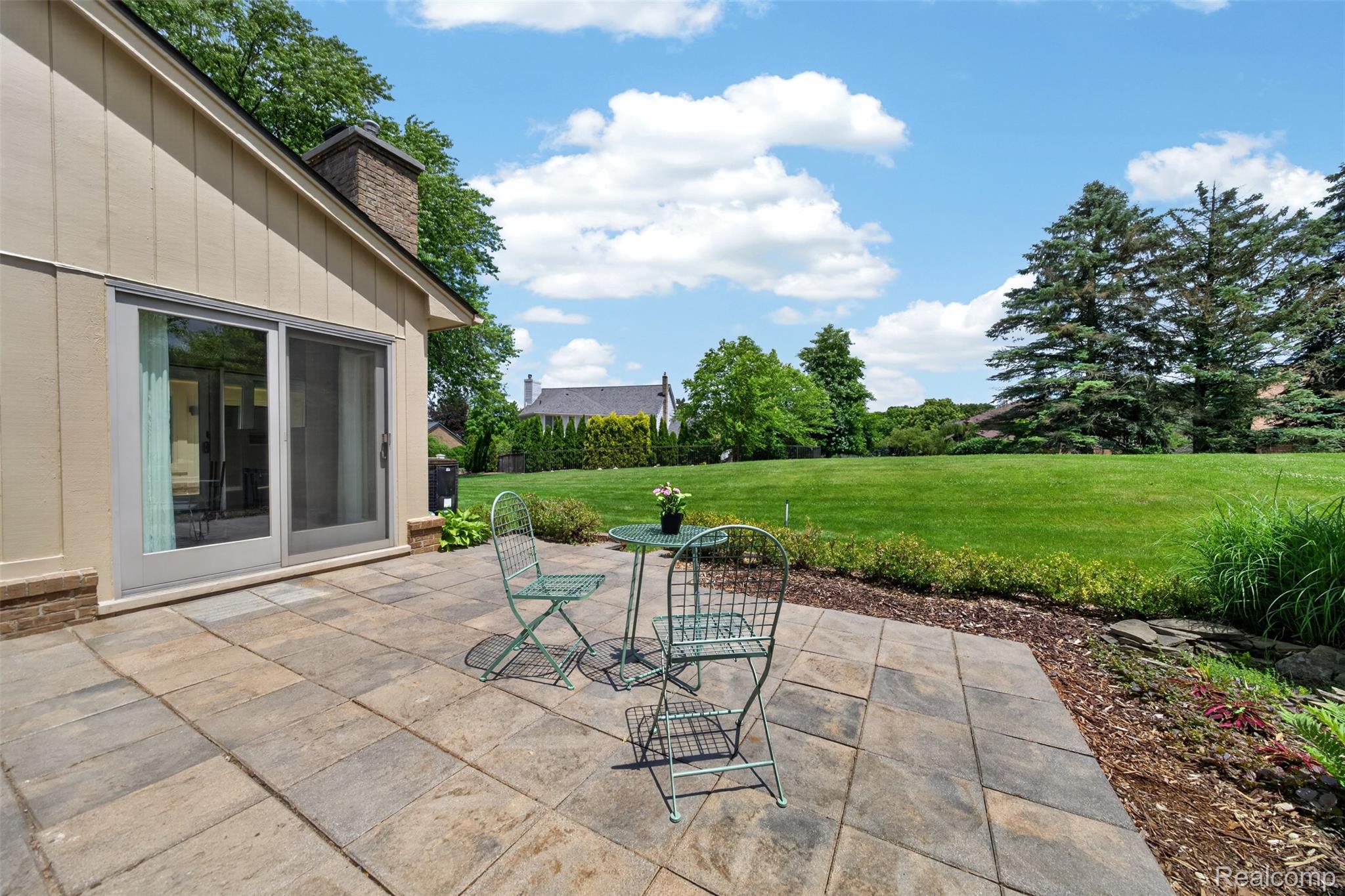 1236 Chaffer Drive Rochester, MI 48306 - Photo 65 of 76 Expansive paver patio with direct access to a large green space