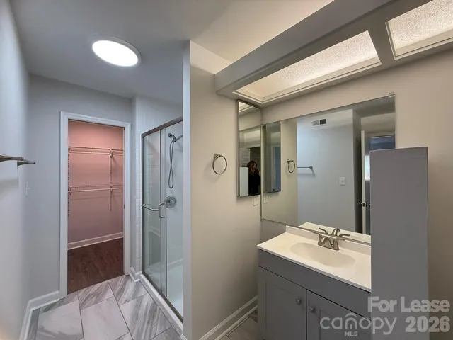 a view of a room with wooden floor and closet