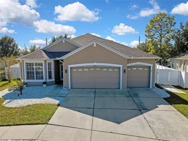 a large kitchen with a table and chairs