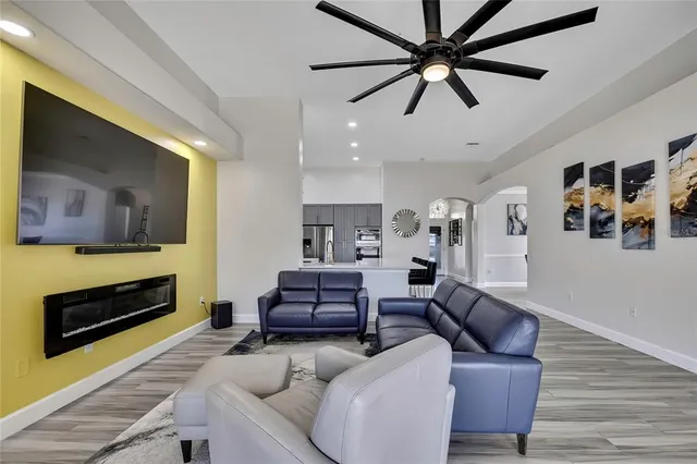 a view of a dining room with furniture wooden floor and a chandelier