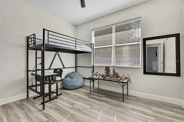 a bedroom with a bed and furniture