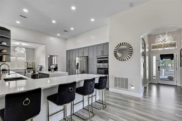 a kitchen with lots of counter top space and dining table