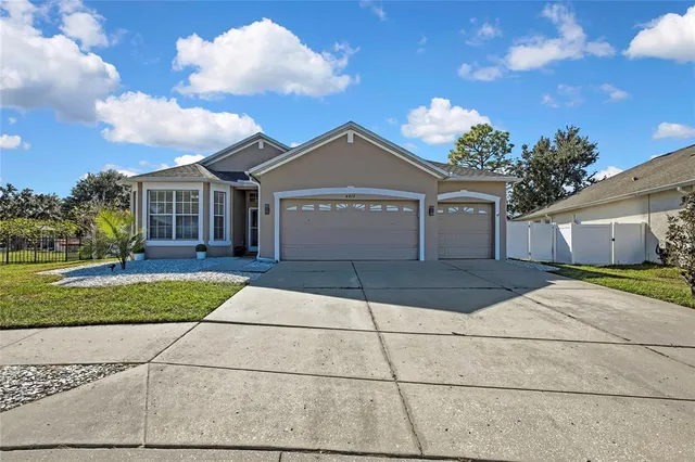 an aerial view of a house with a garden