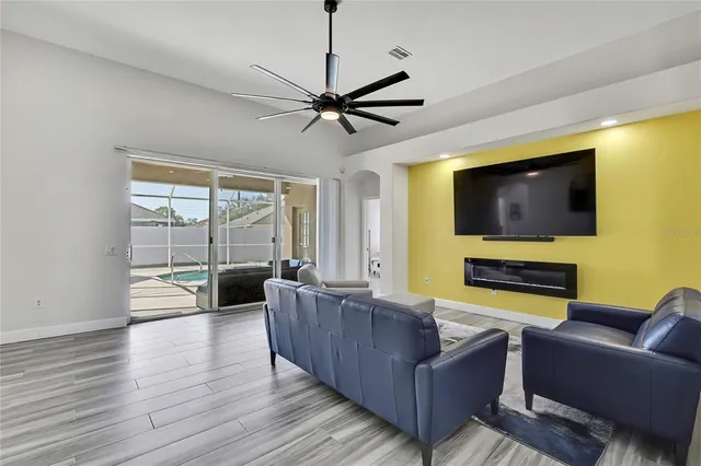 a kitchen with sink a stove and chairs