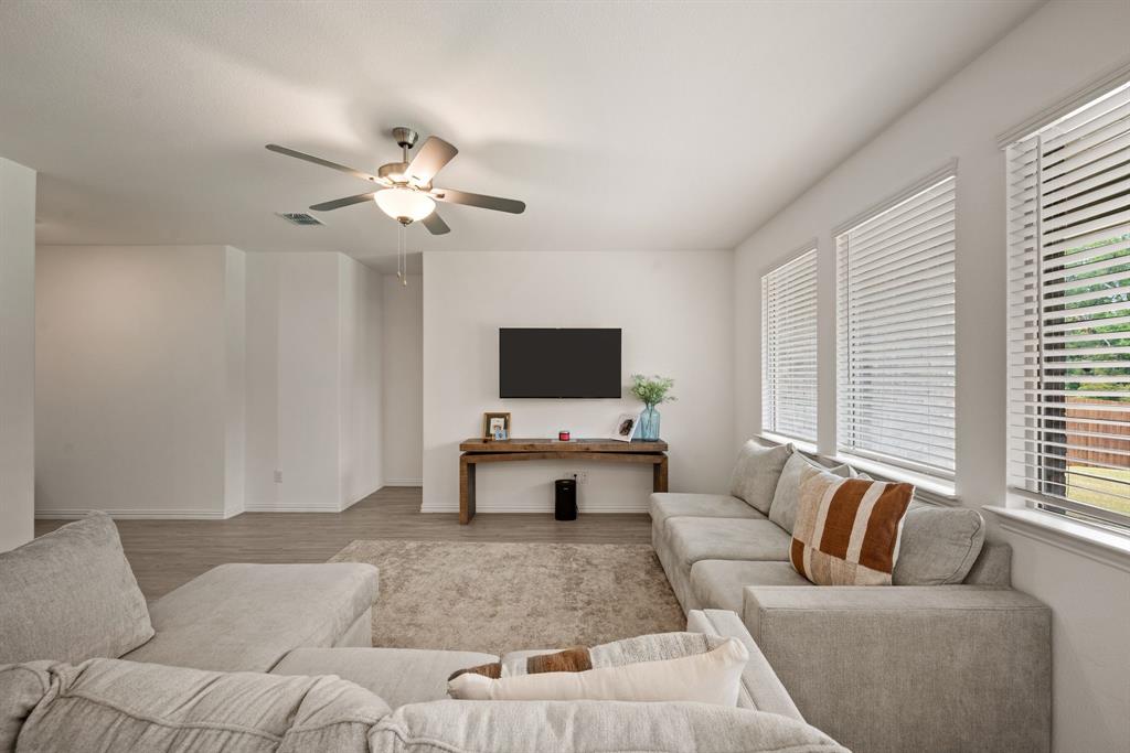 3200 Willow Terrace Lane Anna, TX 75409 - Photo 16 of 40 a living room with furniture and a flat screen tv