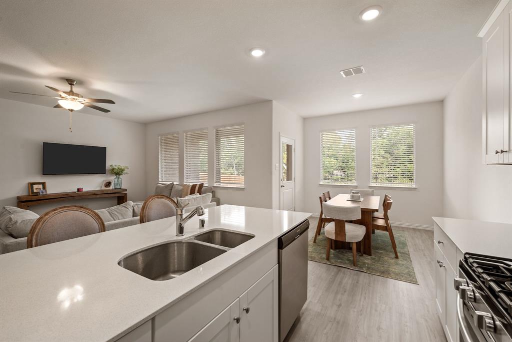 3200 Willow Terrace Lane Anna, TX 75409 - Photo 18 of 40 a living room with furniture and a flat screen tv