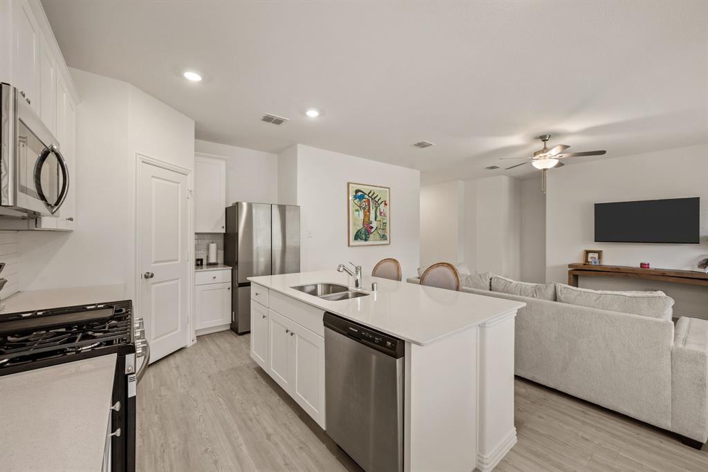 3200 Willow Terrace Lane Anna, TX 75409 - Photo 20 of 40 a kitchen with a sink stove and refrigerator