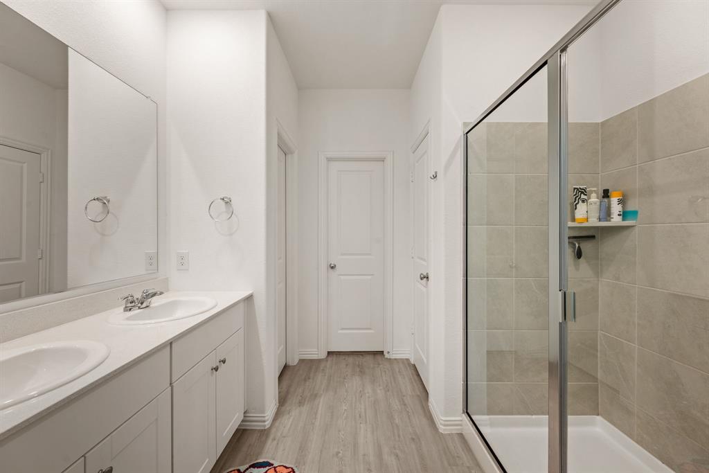 3200 Willow Terrace Lane Anna, TX 75409 - Photo 24 of 40 a bathroom with a double vanity sink and mirror