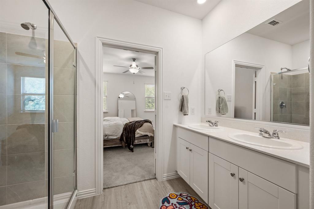 3200 Willow Terrace Lane Anna, TX 75409 - Photo 25 of 40 a en suite bathroom with a double vanity sink a mirror and shower