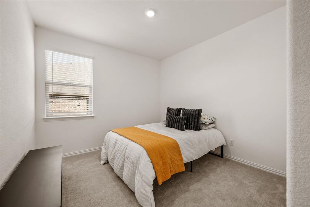 3200 Willow Terrace Lane Anna, TX 75409 - Photo 30 of 40 a bedroom with a bed and window