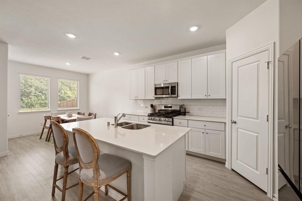 3200 Willow Terrace Lane Anna, TX 75409 - Photo 3 of 40 a kitchen that has a cabinets counter space and appliances