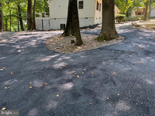 1901 Ridge Road Haymarket, VA 20169 - Photo 16 of 52 a view of a tree in front of a house
