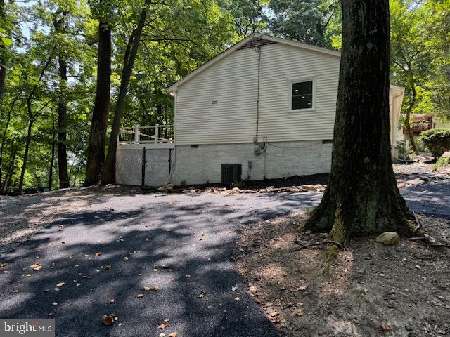 1901 Ridge Road Haymarket, VA 20169 - Photo 17 of 52 a view of a house with backyard and trees