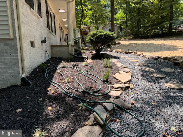 1901 Ridge Road Haymarket, VA 20169 - Photo 18 of 52 a view of a backyard with chair and table