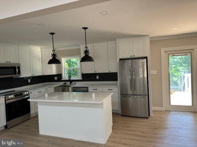 1901 Ridge Road Haymarket, VA 20169 - Photo 22 of 52 a kitchen with appliances a sink and a refrigerator