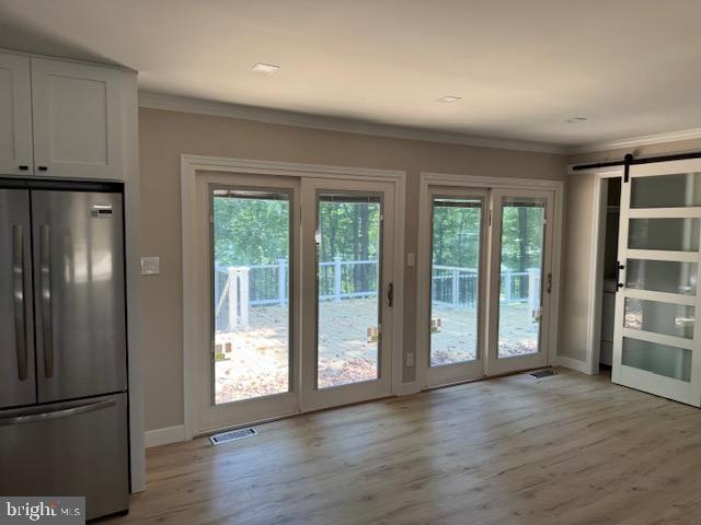 1901 Ridge Road Haymarket, VA 20169 - Photo 23 of 52 a view of an empty room with wooden floor and a window