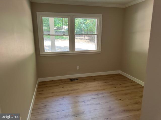 1901 Ridge Road Haymarket, VA 20169 - Photo 31 of 52 a view of an empty room with wooden floor and a window