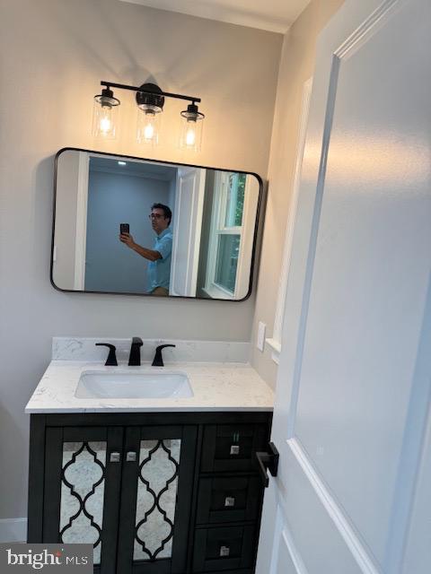 1901 Ridge Road Haymarket, VA 20169 - Photo 36 of 52 a bathroom with a sink and a mirror