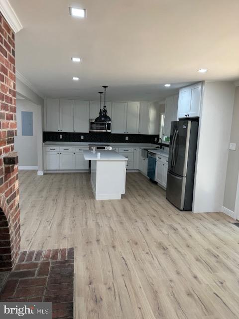 1901 Ridge Road Haymarket, VA 20169 - Photo 47 of 52 a kitchen with stainless steel appliances kitchen island granite countertop a refrigerator and a stove top oven