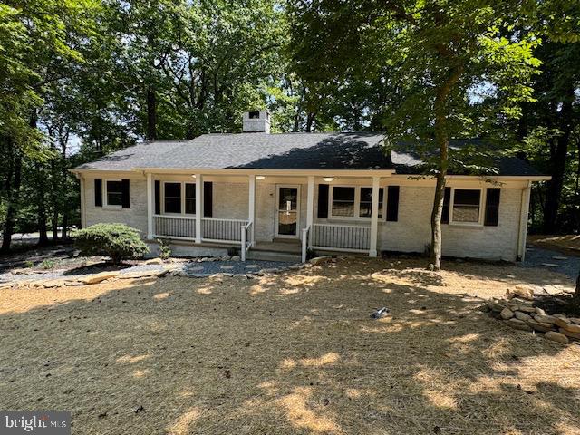 1901 Ridge Road Haymarket, VA 20169 - Photo 10 of 52 a front view of a house with yard tree and glass windows