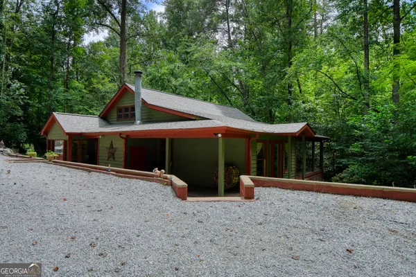 a view of a livingroom with furniture and a fireplace