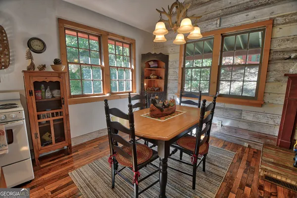 a view of balcony with wooden floor and fence