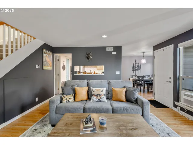 a living room with furniture and a rug