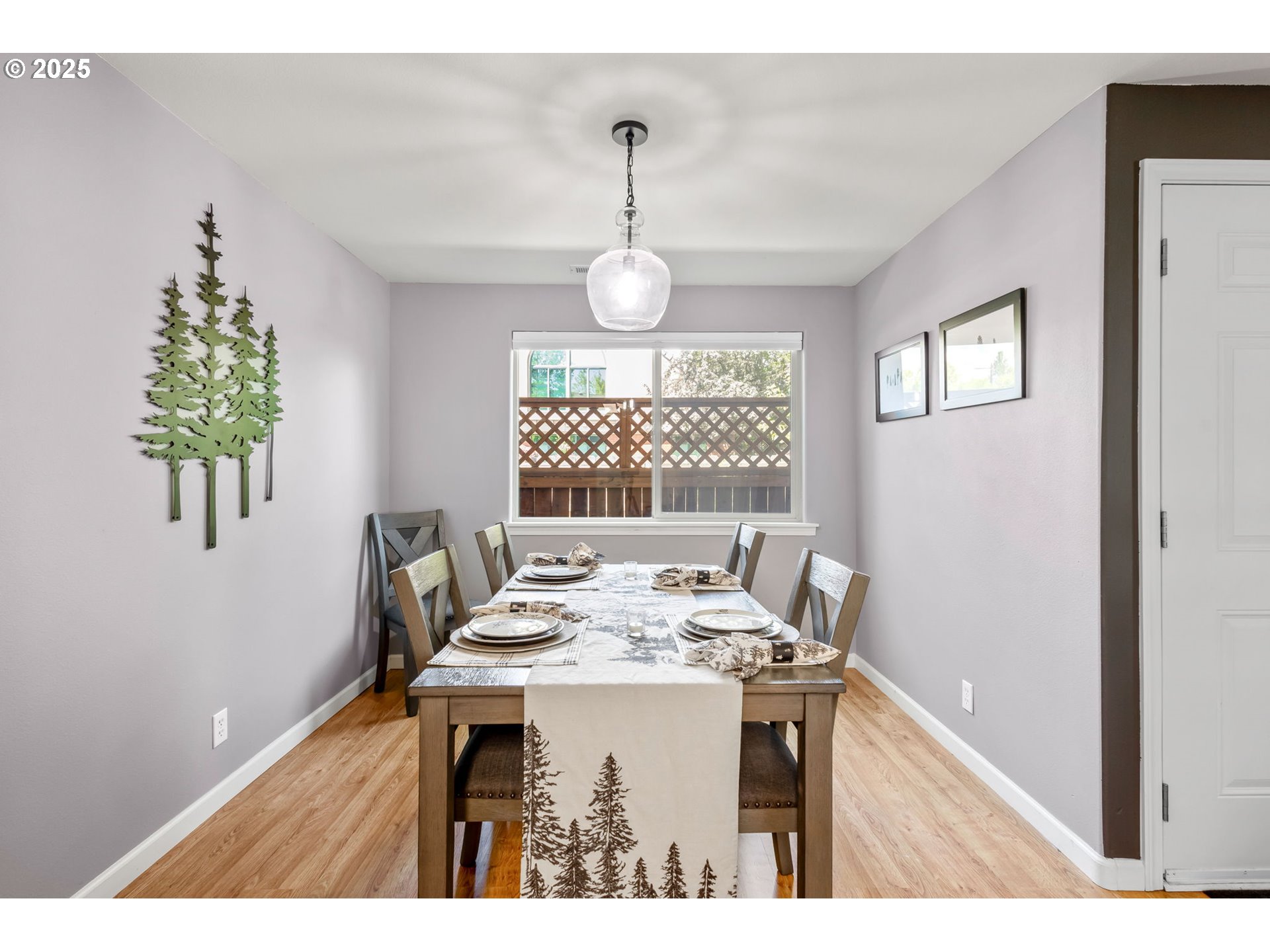 111 Northwest Hawthorne Avenue, Unit 1 Bend, OR 97703 - Photo 14 of 31 a view of a dining room with furniture window and wooden floor