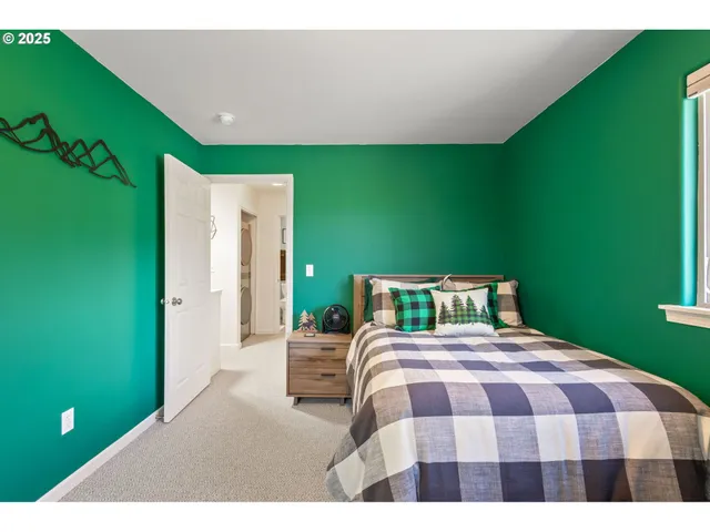 a bedroom with a bed and a bookshelf