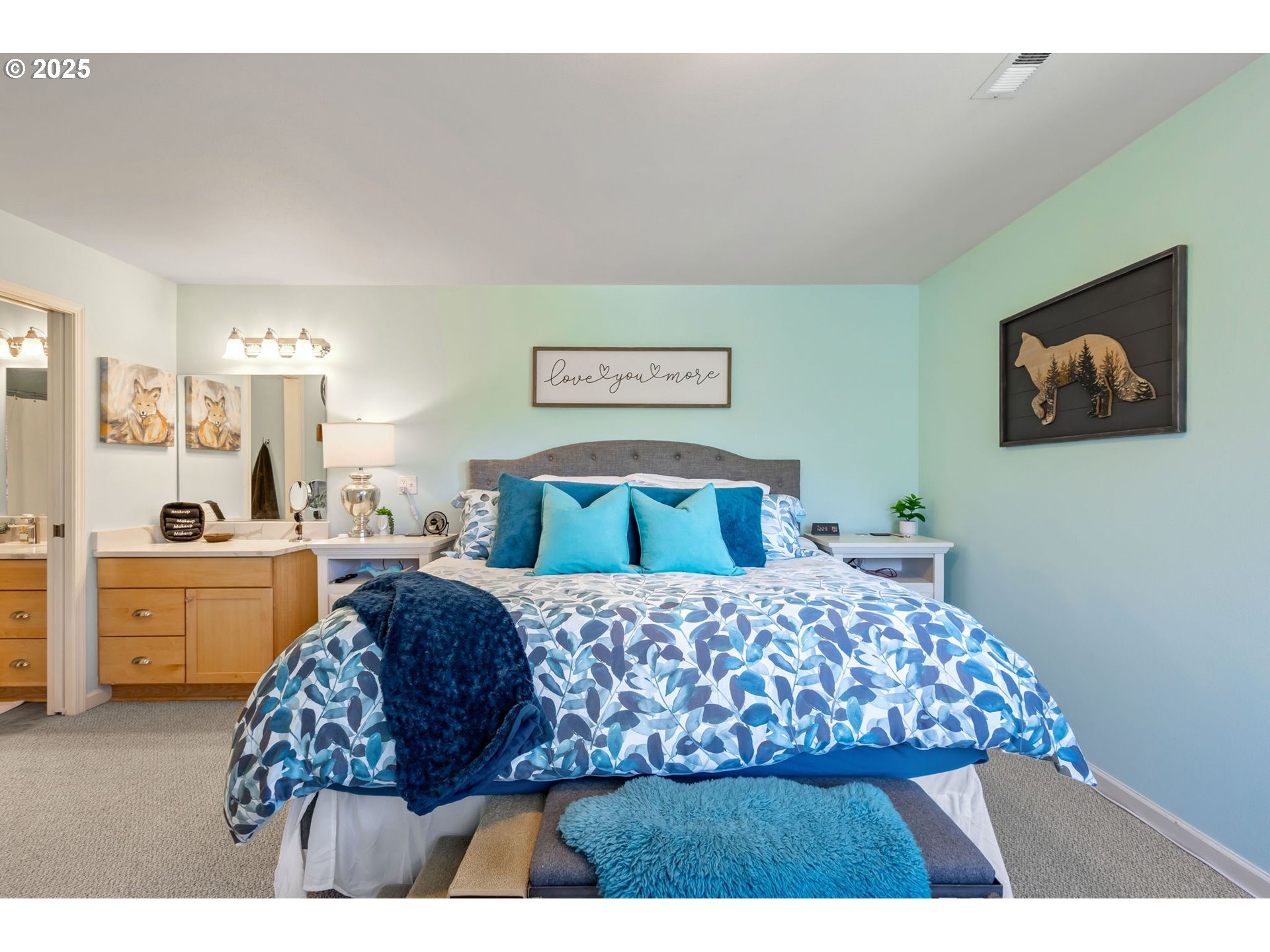 111 Northwest Hawthorne Avenue, Unit 1 Bend, OR 97703 - Photo 23 of 31 a large bedroom with a bed and a couch