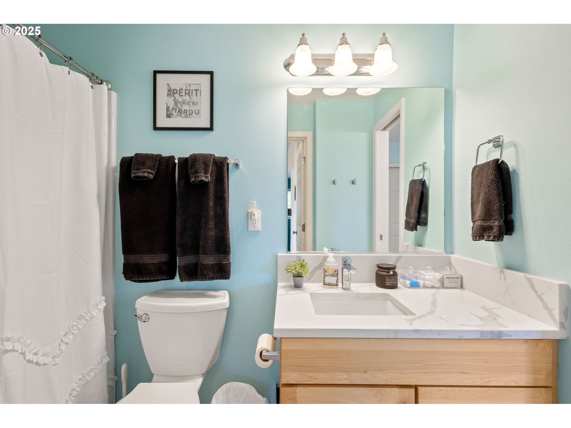 111 Northwest Hawthorne Avenue, Unit 1 Bend, OR 97703 - Photo 26 of 31 a bathroom with a toilet sink and mirror