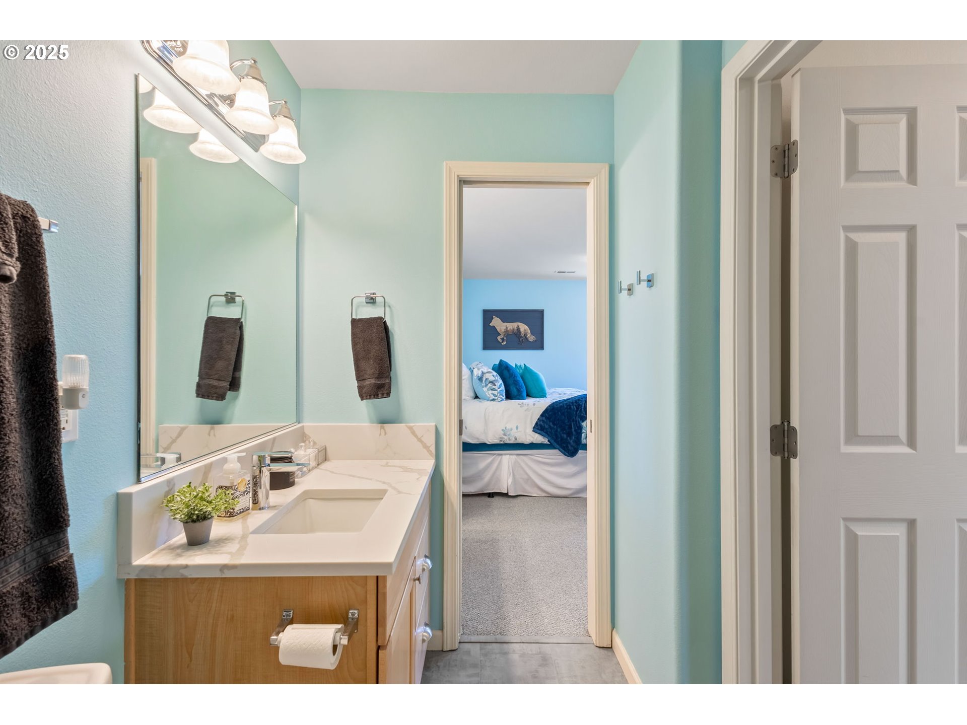 111 Northwest Hawthorne Avenue, Unit 1 Bend, OR 97703 - Photo 27 of 31 a en suite bathroom with a sink and mirror