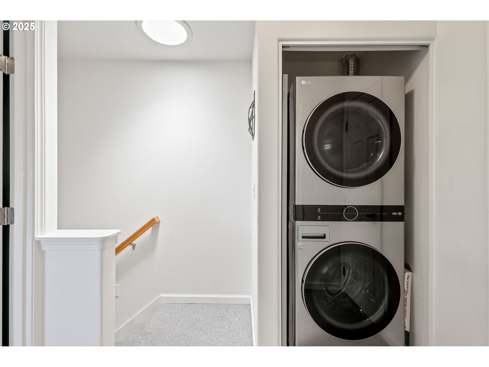 111 Northwest Hawthorne Avenue, Unit 1 Bend, OR 97703 - Photo 28 of 31 a view of a hallway with washer and dryer