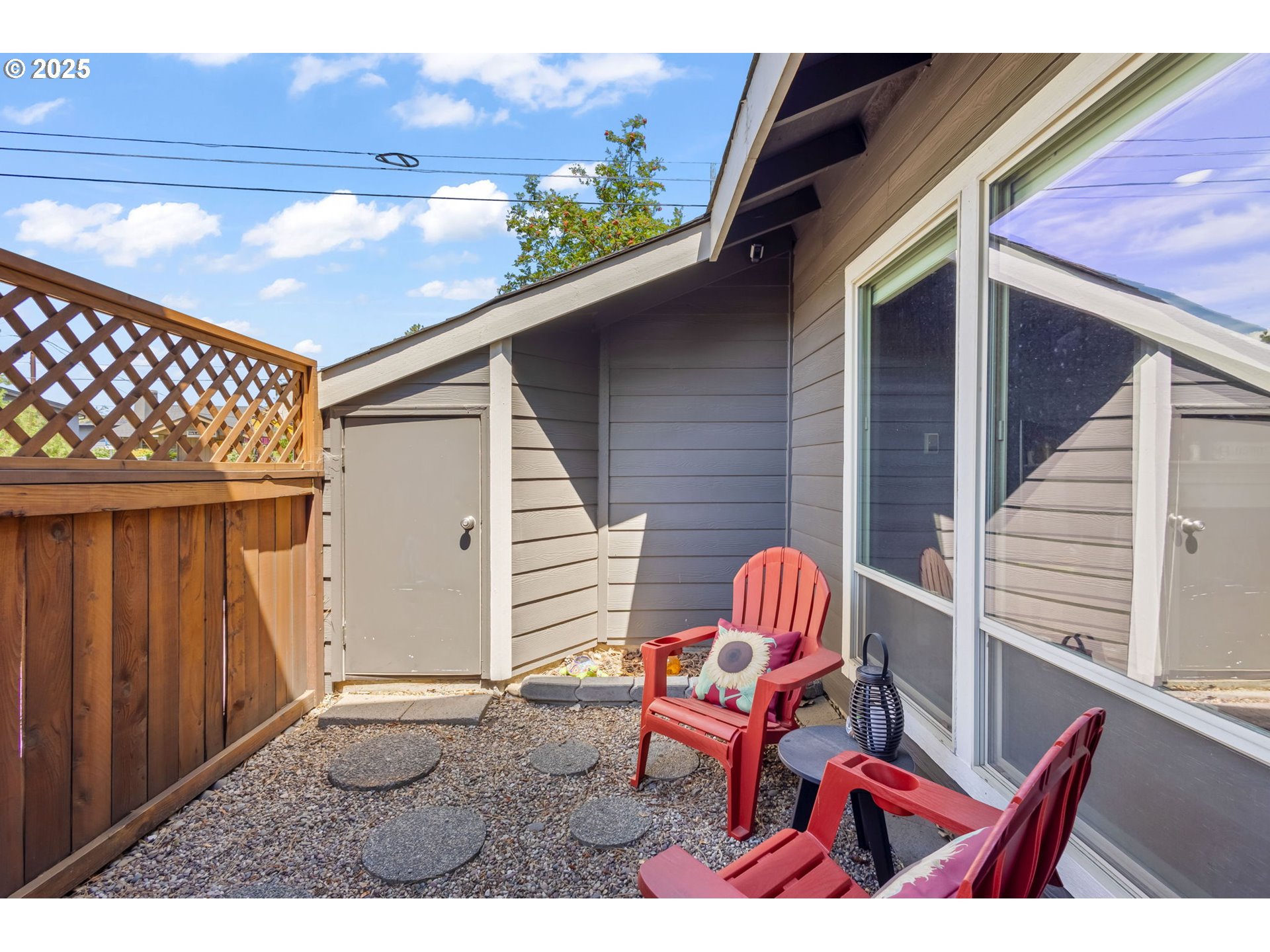 111 Northwest Hawthorne Avenue, Unit 1 Bend, OR 97703 - Photo 29 of 31 a backyard of a house with table and chairs