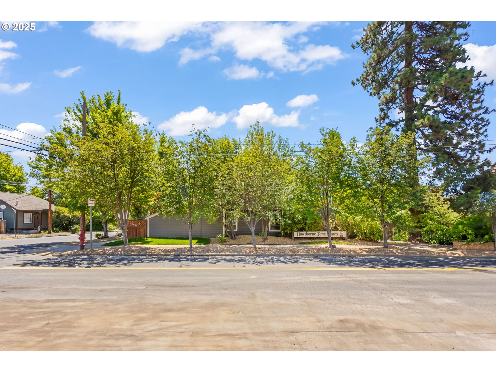111 Northwest Hawthorne Avenue, Unit 1 Bend, OR 97703 - Photo 31 of 31 a street view with large trees