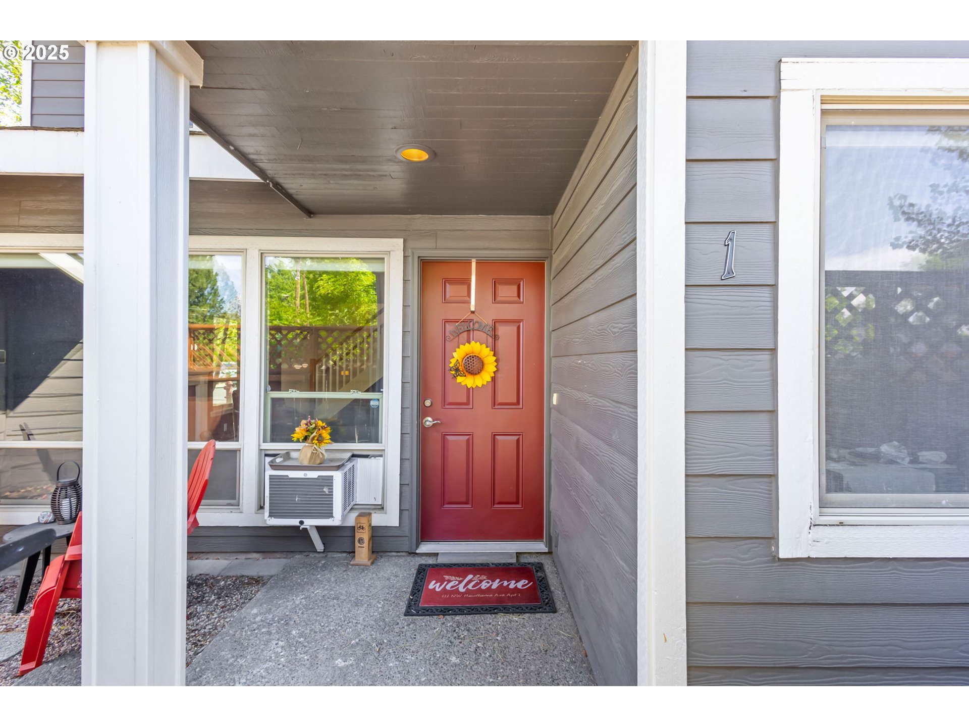 111 Northwest Hawthorne Avenue, Unit 1 Bend, OR 97703 - Photo 5 of 31 a living room with furniture and a window