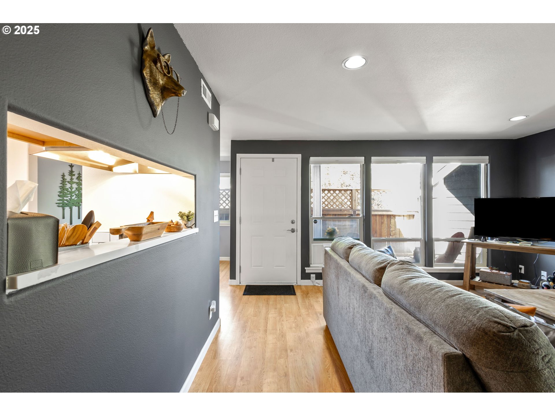 111 Northwest Hawthorne Avenue, Unit 1 Bend, OR 97703 - Photo 6 of 31 a living room with furniture and a flat screen tv