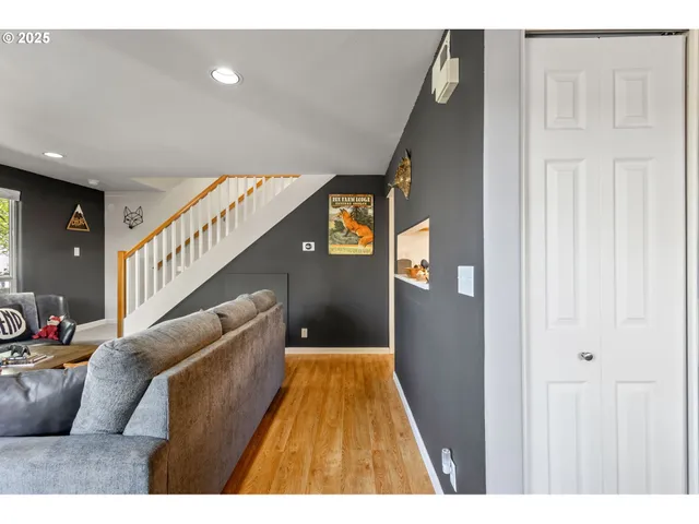 a view of entryway and hall with wooden floor