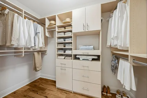 a bedroom with furniture and a chandelier