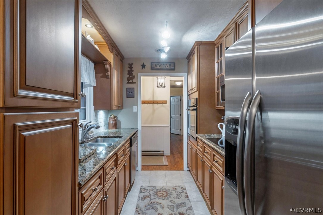 8400 Varina Road Henrico, VA 23231 - Photo 8 of 28 a kitchen with refrigerator cabinets and stainless steel appliances