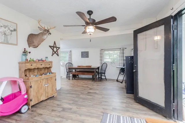 a living room with furniture and a clock